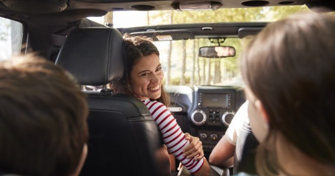 A family sitting in a car together